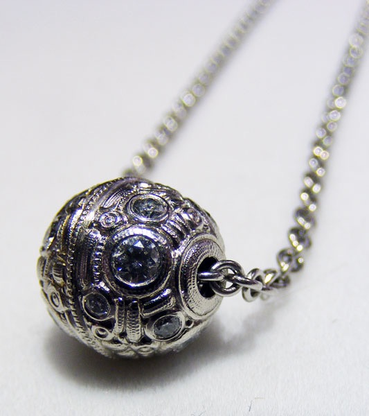 #M-2NPD
“Ball” pendant in Platinum with 14 diamonds of 0.42 ct total (F-G/VVS), on a Platinum 18” 1.9mm cable chain. 
$5,675
