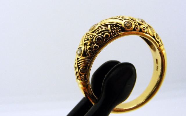 R50DC
“Arc” diamond ring in 18K yellow gold with natural color diamonds totaling 0.33 ct. 
Available for immediate delivery in finger size 6.5, 
$4820
