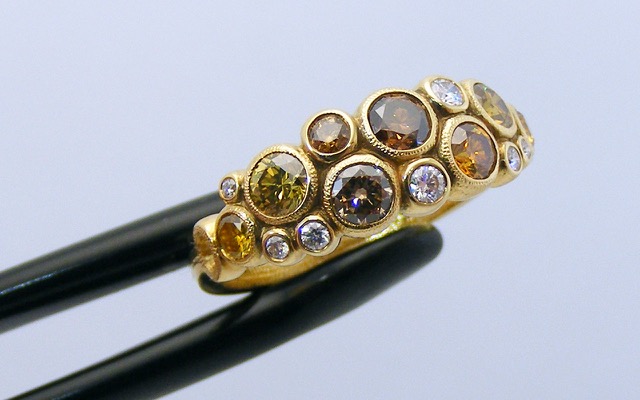 R-113DC
Natural color and white diamond ring in 18K yellow gold with 8 natural color diamonds totaling 0.98 ct. and 7 white diamonds totaling 0.12 ct. 
Available for immediate delivery in finger size 7.
$8,035
