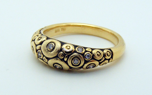 R132
18K yellow gold and diamond “Orchard” dome ring, 12 diamonds totaling 0.11 ct. 
Immediately available in size 6 ¼.
$2,335
