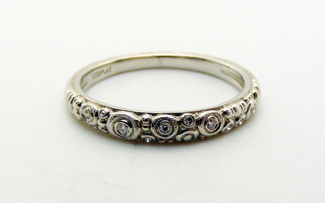 R168P
Platinum and diamond ring, 9 diamonds totaling 0.05 ct.
Immediately available in size 7.
$2,240
