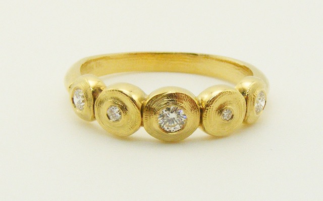 R210D
“5-Seed” diamond ring in 18K yellow gold with 5 diamonds totaling 0.20 ct. 
Available for immediate delivery in finger size 6 ¼.
$2,175
