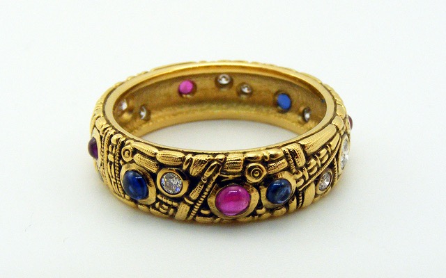 R7
Sapphire, ruby and diamond ring, 18K yellow gold, 6mm wide. Three blue sapphire cabochons totaling 0.25 ct, 4 ruby cabochons totaling 0.25 ct and 11 diamonds totaling approx. 0.25 ct
Available for immediate delivery in finger size 6 ½. 
$3,645.00
