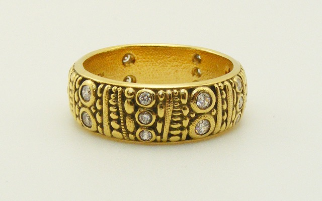 R-22
“Carved” diamond ring, 18K yellow gold, 6.9mm wide, 20 diamonds totaling 0.29 ct. 
Available for immediate delivery in finger size 6 ¼.
$4,485.00
