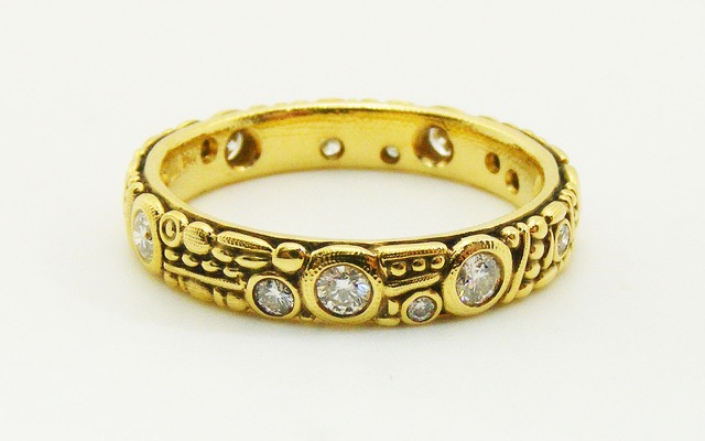R62D
18K and diamond band, 3.5mm wide, 14-15 diamonds totaling approximately 0.42 ct.
Immediately available in size 7
$3,780.00
