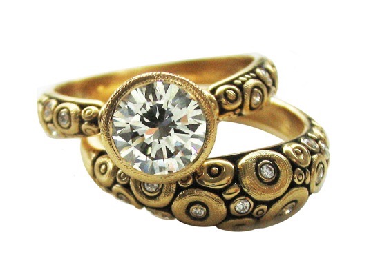 R128YY7.3
“Martini” diamond ring, 18K yellow gold, 1.34 ct center diamond (K-L/VVS), 17 side diamonds totaling 0.20 ct. Available for immediate delivery in finger size 7 (7 ¼ LE) 
$14,370.00 Paired with R132
18K yellow gold and diamond “Orchard” dome ring, 12 diamonds totaling 0.11 ct. 
Immediately available in size 6 ¼.
$2,335.00

