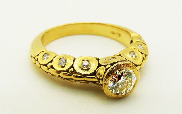R-41M
“Fish” diamond ring, 18K yellow gold, 0.51 ct diamond center with GIA certificate, 15 side diamonds totaling 0.20 ct. 
Available for immediate delivery in finger size 6 ½  
$6,415
