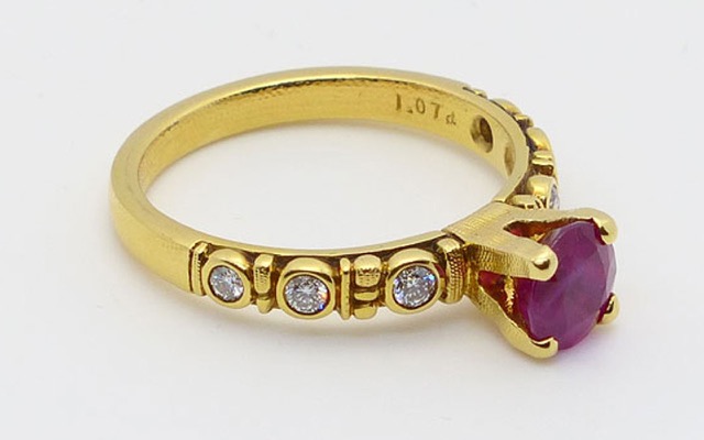R-166M
“Circle” ruby ring, 18K yellow gold, 1.07 ct Ruby, 6 diamonds of 0.15 ct total. 
Available for immediate delivery in finger size 5 ¾ 
$5,430
