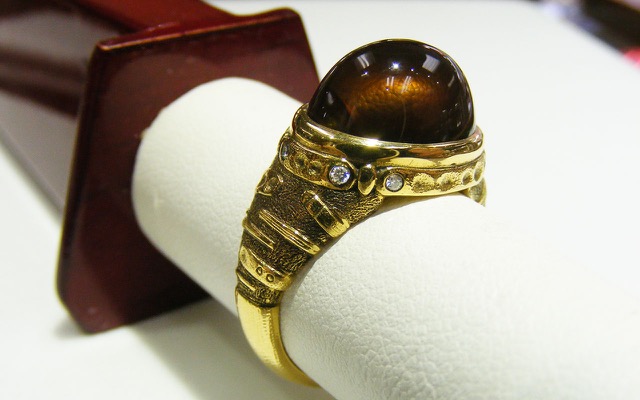 R-172
“Sea Grass” fire agate ring,18K yellow gold 8 diamonds totaling 0.08 ctw. Available for immediate delivery in finger size 9 ¼. 
$4,475
