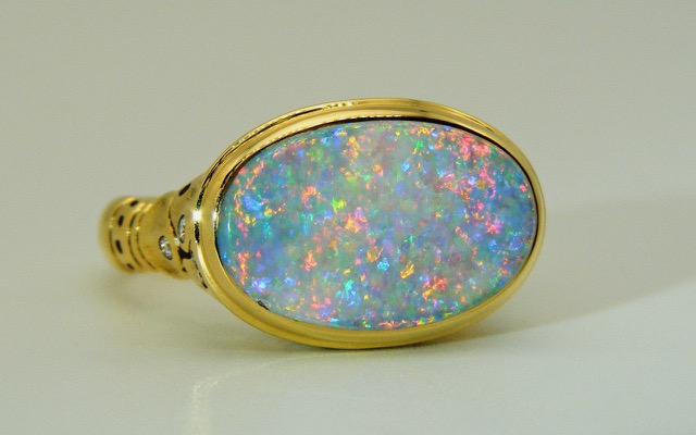 R-194
“Flora” ring in 18K yellow gold with a 2.77 ct Australian Lightning Ridge Pinfire Opal center gemstone and 11 diamonds of 0.15 ct total. 
In store at Studio Jewelers in a size 6 ¾. 
$7,800
