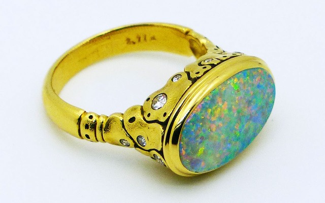 R-194
“Flora” ring in 18K yellow gold with a 2.77 ct Australian Lightning Ridge Pinfire Opal center gemstone and 11 diamonds of 0.15 ct total. 
In store at Studio Jewelers in a size 6 ¾. 
$7,800
