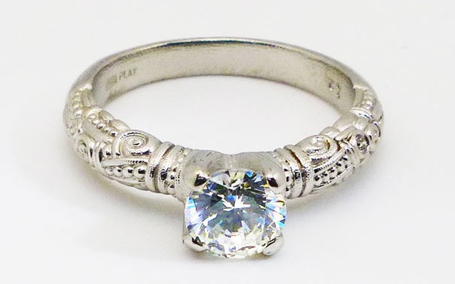 R-56PM
Platinum Cubic Zirconia and diamond ring, CZ center stone (fits a 6.5-7.5mm round stone), 1 accent diamond totaling 0.015 ct.
Immediately available in size 7 3/4					
$3940
