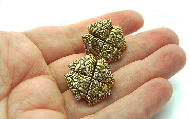 E25 
“Arc” earrings, 18K yellow gold, .56 ctw diamonds. (No longer in catalog)
$12,075
