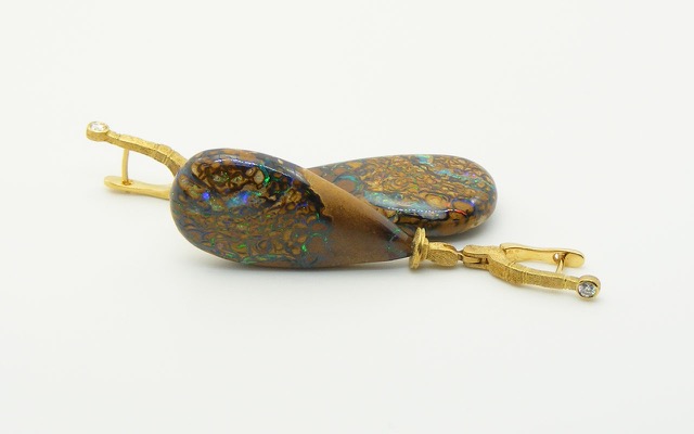 E132D
“Sticks & Stones” earrings in 18K yellow gold with boulder opal drops and 2 diamonds totaling.11 ct. This is Queensland Matrix Boulder Opal at its most compelling: rich caramel and chocolate browns intertwined with brilliant rivers and pinpoints of gem opal in every color in the rainbow. The backs of these gems are just as lovely as the front.
Immediate delivery  
$12,290
