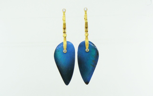 E167MD
“Sticks & Stones” earrings in18K yellow gold with boulder opal drops and 4 diamonds totaling 0.17 ct. These dramatic wing-shaped Australian boulder opal splits have glowing, fully polished surfaces and an unusual blue palette that includes periwinkle, teal, and peacock, transitioning to deep royal blue at the edges.  No photograph can capture the way they glow!
Immediate delivery 
$7,475
