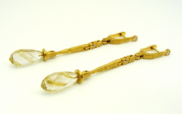 E136MD (Sold)
“Sticks and Stones” Rutilated Quartz earrings, 18K Yellow gold, 4 diamonds totaling 0.17 ctw. Rutilated Quartz faceted briolette drops are 9.56 ctw.

