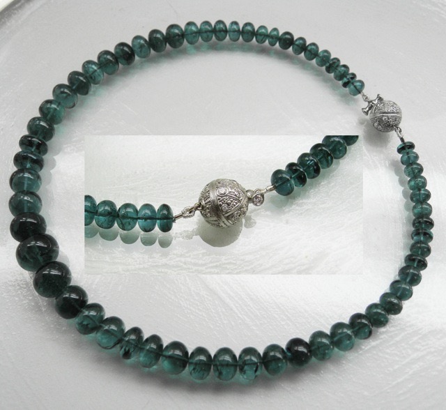 M-3PC
Rare indicolite (blue) tourmaline bead necklace with platinum and diamond ball clasp M-3PC containing 0.54 ctw integrally set diamonds. Alex’s platinum ball clasp is a fitting accompaniment to this graduated strand of very fine and rare natural indicolite tourmaline rondelles, 362 carats in total.
immediate delivery
$25,835.00
