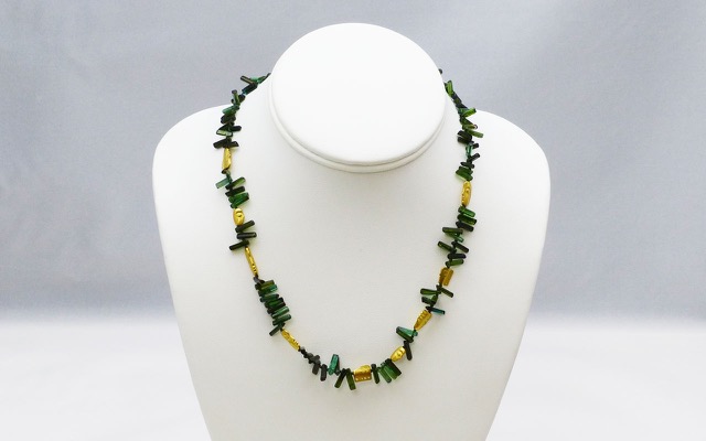 “The Big Sleep” necklace, 18KY, polished natural crystals of Green Tourmaline interspersed with Alex’s compelling face beads.
$4,600.00
