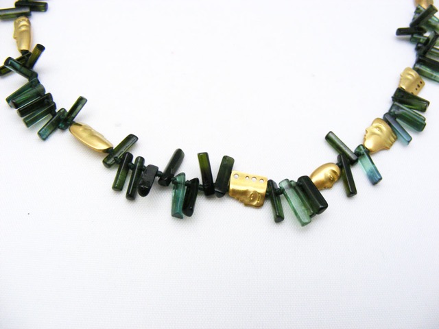 “The Big Sleep” necklace, 18KY, polished natural crystals of Green Tourmaline interspersed with Alex’s compelling face beads.
$4,600.00
