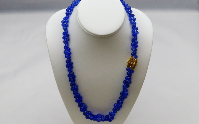 Double-strand Tanzanite bead necklace with 18K yellow gold and diamond clasp. Periwinkle that subtly shifts from royal blue to violet when you look at it from different angles is the hallmark of this amazing African gemstone. Tanzanites total 417 carats and the “Little Windows” clasp (M-71C) contains seven diamonds totaling 0.12 ct.
immediate delivery
 $13,375.00
