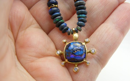 Opal-SS-pendant-in-hand-1.jpg