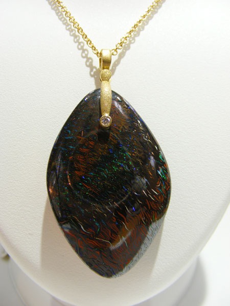 #M-57D
“Sticks & Stones” pendant in 18K yellow gold, featuring a 71.28 ct Fire Matrix Boulder Opal and  .03 ct diamond (F-G/VVS)
$3,195
(Chain not included in price. This item is available in-store.)
