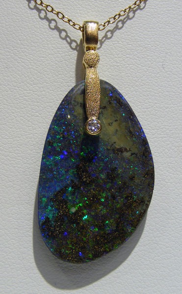 #M-57MD
“Sticks & Stones” in 18K yellow gold, featuring a 23.55 ct Matrix Boulder Opal and .03 ct diamond (F-G/VVS)
$1,762
(Chain not included in price. This item is available in-store.)
