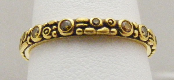 R117DC
“Mini 62”, 18KY, .25 ctw natural colored diamonds, 2.5mm wide, in store in size 6 ¾
$2,765
