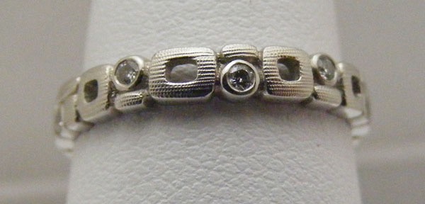 R119P
Micro Windows”, Platinum, .11 ctw diamonds, 3mm wide, in store in size 6 ¾
$2,785
