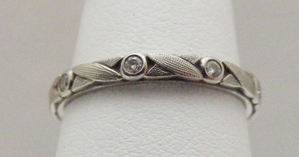 R121P
“Vine”, Platinum, .14 ctw diamonds, 2.4mm wide, in store in size 5 ½ 
$2,605 
