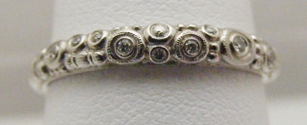 R168P
Platinum & diamond ring, (.05 ctw diamonds), in store in size 7
$2,240
