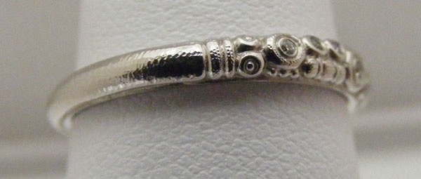 R168P
Platinum & diamond ring, (.05 ctw diamonds), in store in size 7
$2,240
