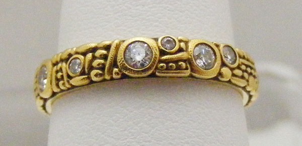 R620
18KY, .42 ctw diamonds, 3.5 mm wide, in store in size 7 ¼
$3,780

